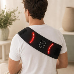 Person wearing the red light therapy wrap across the shoulder and upper back